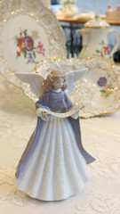 Fototapeta na wymiar antique dish with angel figurine