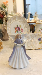 antique dish with angel figurine