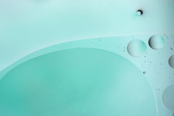 Light blue abstract background picture made with oil, water and soap