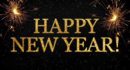 Black background with sparklers and glittery letters showing the words happy new year