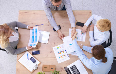 Business meeting - manager discussing work with his colleagues