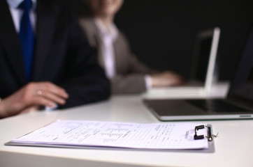 Business meeting at the table shaking hands conclusion of the c