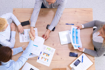 Business meeting - manager discussing work with his colleagues