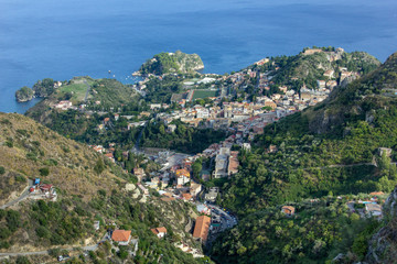 Fototapeta na wymiar The view from village Castelmola at mountain, view of Mediterranean Sea and the skyline of Taormina.