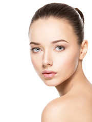 Fototapeta premium Beautiful face of young woman with healthy clean skin