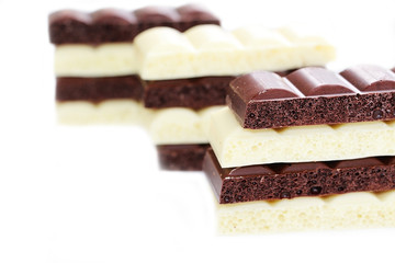 Chocolate is white and black. Porous chocolate. Dessert. Cocoa.