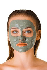 Woman with face mask of clay. Cleansing mask for oil skin with acne.