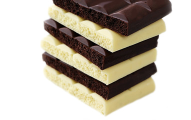 Chocolate is white and black. Porous chocolate. Dessert. Cocoa.