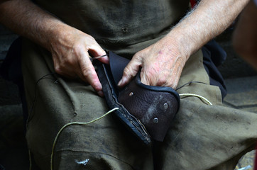 Shoemaker performs shoes in the studio craft in Istanbul