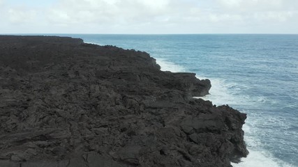 Slow Motion Aerial Of Waves Colliding With Fresh Lava Rock From 2018 Flow In Isaac Hale Park.