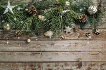 Christmas background. Spruce and pine branches with shiny balls on a wooden old vintage Board background. Christmas toy. Christmas. The view from the top. Christmas decorations.