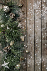 Christmas background. Spruce and pine branches with shiny balls on a wooden old vintage Board background. Christmas toy. Christmas. The view from the top. Christmas decorations.