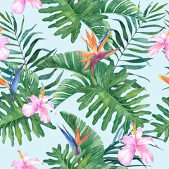 Wall murals Paradise tropical flower Tropical watercolor seamless pattern with exotic hibiscus and strelitzia flowers and leaves on a blue background.