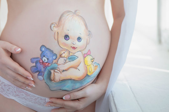 Beautiful drawing on the stomach of a pregnant woman