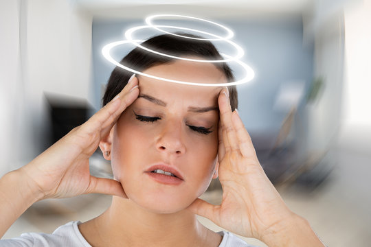 Woman Suffering From Headache Dizziness