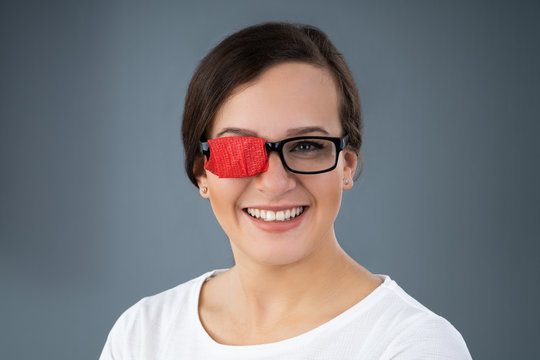 Woman In Glasses With Patch To Treat Lazy Eye