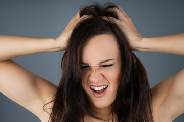 Naklejka premium Woman Scratching Her Itchy Head