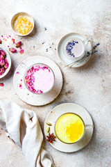 Variety of Moon Milk for a better sleep. Turmeric golden milk, pink rose milk and lavender moon milk. Trendy relaxing bedtime drink