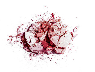 Crushed eyeshadows and powder isolated on white background