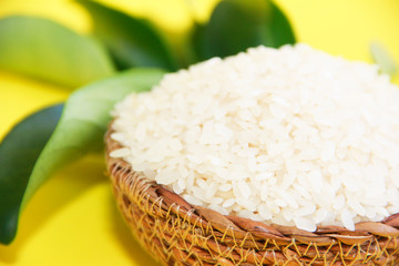 white fresh natural rice with a decorative brown wooden plate