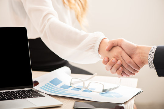 Business people handshake after partnership contract signing at office