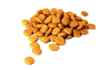 Cat food. Brown dry food. Square pieces.