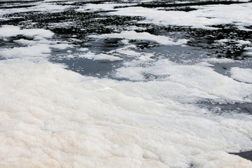 Foam on the surface of a river.