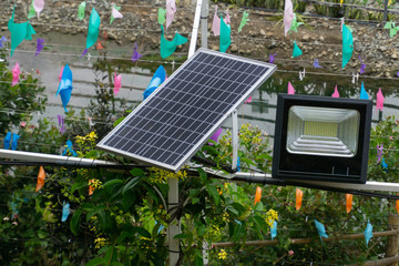 Solar panel with outdoor LED light in the garden