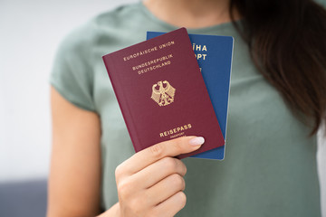 Woman Holding Two Passports