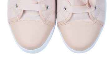 Women's pink canvas sneakers with beads close-up toe on a white background