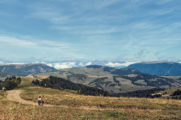 Mountainous trail with hikers in Dolomites, Italy