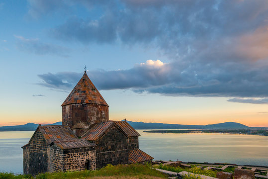 Heavy dramatic clouds over Lake Sevan and Sevanavank Monastery in Armenia
