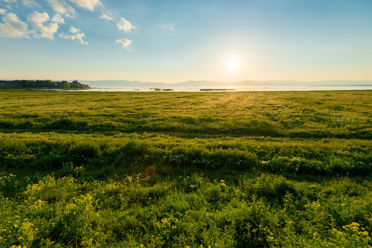 View of Lake Sevan in the rays of the rising sun, the picturesque landscape of Armenia, a natural landmark