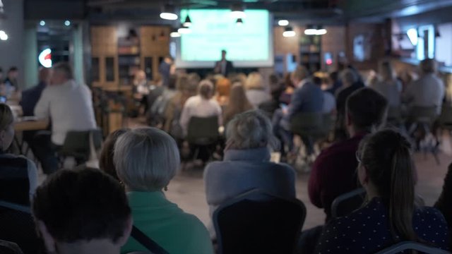 Audience listens lecturer at workshop