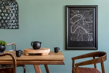 Stylish and design dining room interior with black mock up poster map, wooden table, chair, teapot...