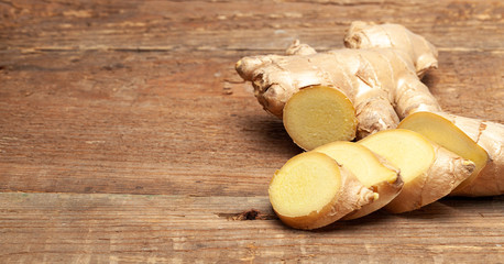 Raw ginger root on a wooden table