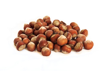 Shelled hazelnuts on isolated white background