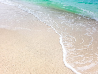 wave on brown sand beach