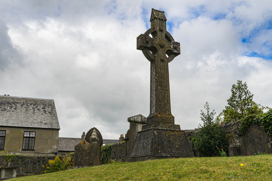 Cemetery with Celtic crosses in the city of Kilkenny in Ireland, with cloudy sky.
