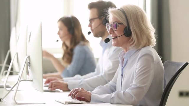 Aged call center employee provide help to client distantly