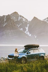 Travel by rental car woman on road trip in Norway adventure lifestyle concept vacations outdoor...