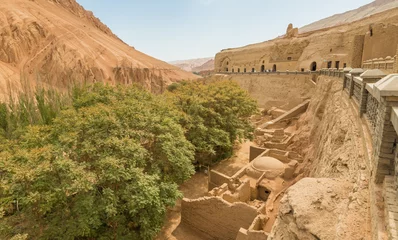 Selbstklebende Fototapeten Turpan, China - composed by 77 rock-cut caves, each with the ceiling covered with Buddha murals, the Bezeklik Caves are among the main attractions of Turpan prefecture © SirioCarnevalino