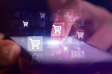 Finger touching phone with online shopping concept and dark background