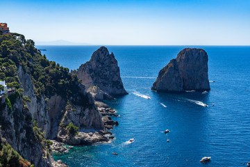 Fototapeta premium The dramatic Faraglioni are the most most iconic sight of Capri, Campania, Italy