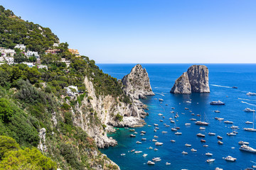 The beautiful coastline of Capri with the Faraglioni, the most iconic sight of the island, Campania, Italy