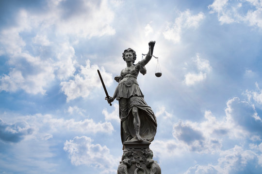 Justilia, Lady Justice or Themis and blue sky