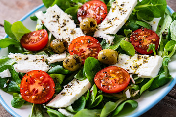 Greek salad on wooden background