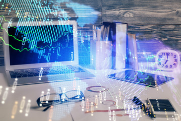 Multi exposure of graph and financial info and work space with computer background. Concept of international online trading.