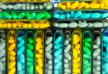 Abstract background, various flavored candies in colorful packaging