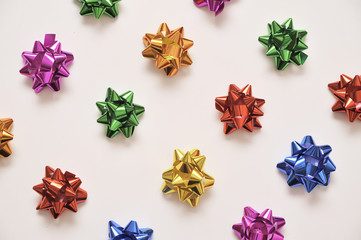 Festive colorful bows on white background. Holiday background. Christmas concept.